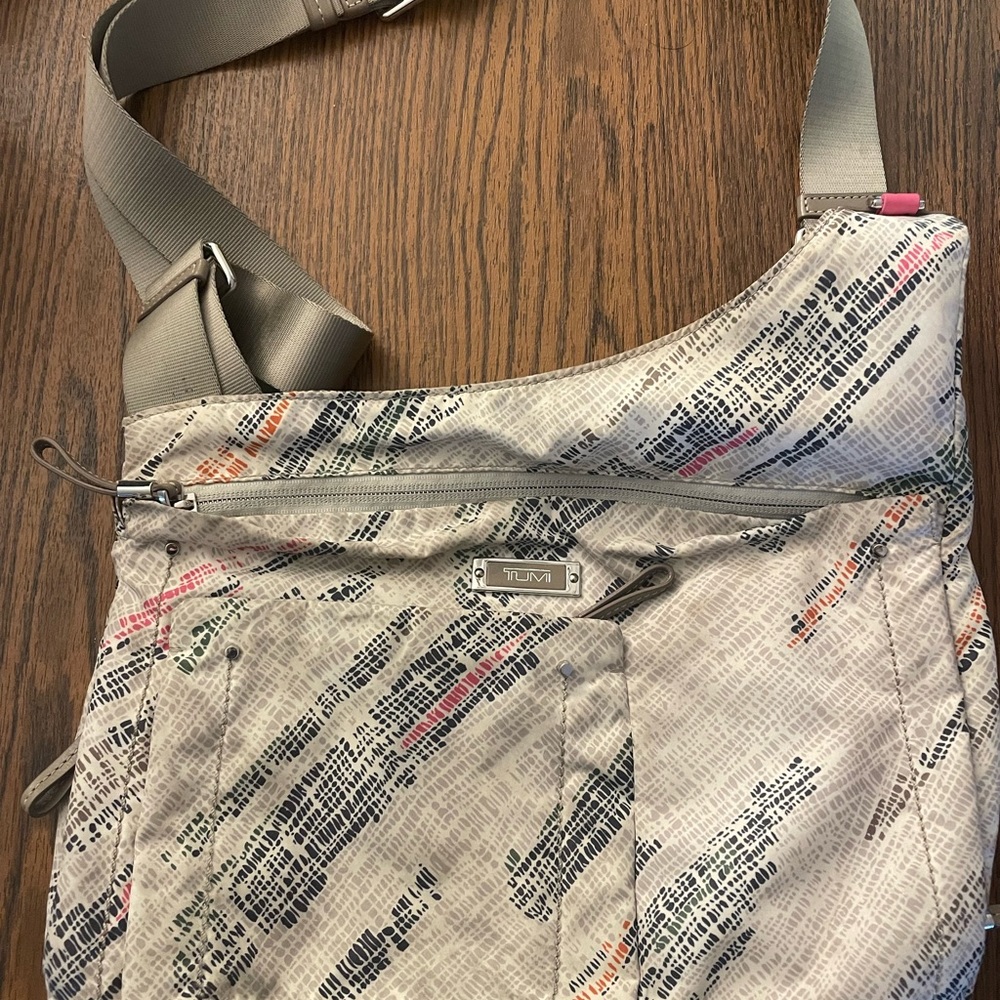 Tumi Crossbody Bag with Many Compartments and Adjustable Crossbody Strap